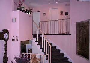 main hall looking up to bedrooms down to den.jpg